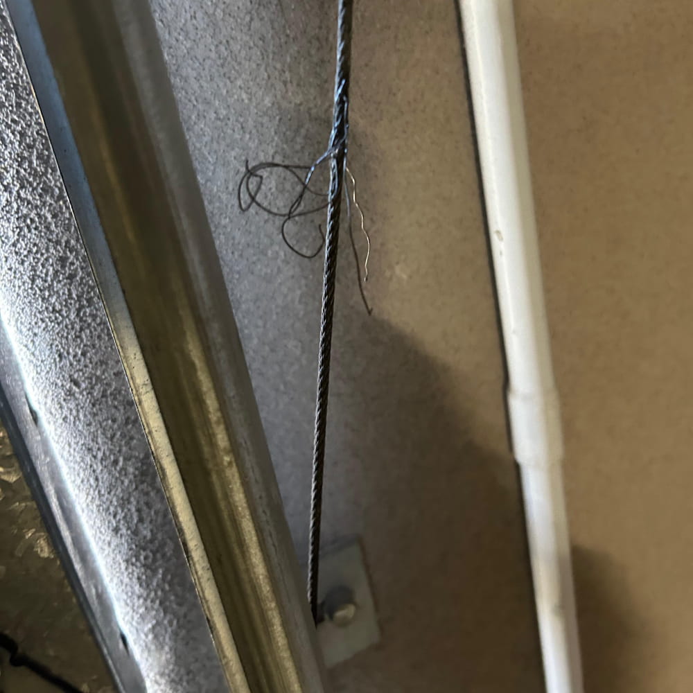 Frayed garage door lift cable requiring replacement in Applecross, Perth
