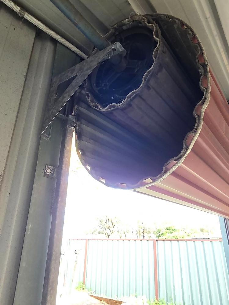 Roller door curtain rolled onto the drum with the mounting bracket visible in Armadale, Perth